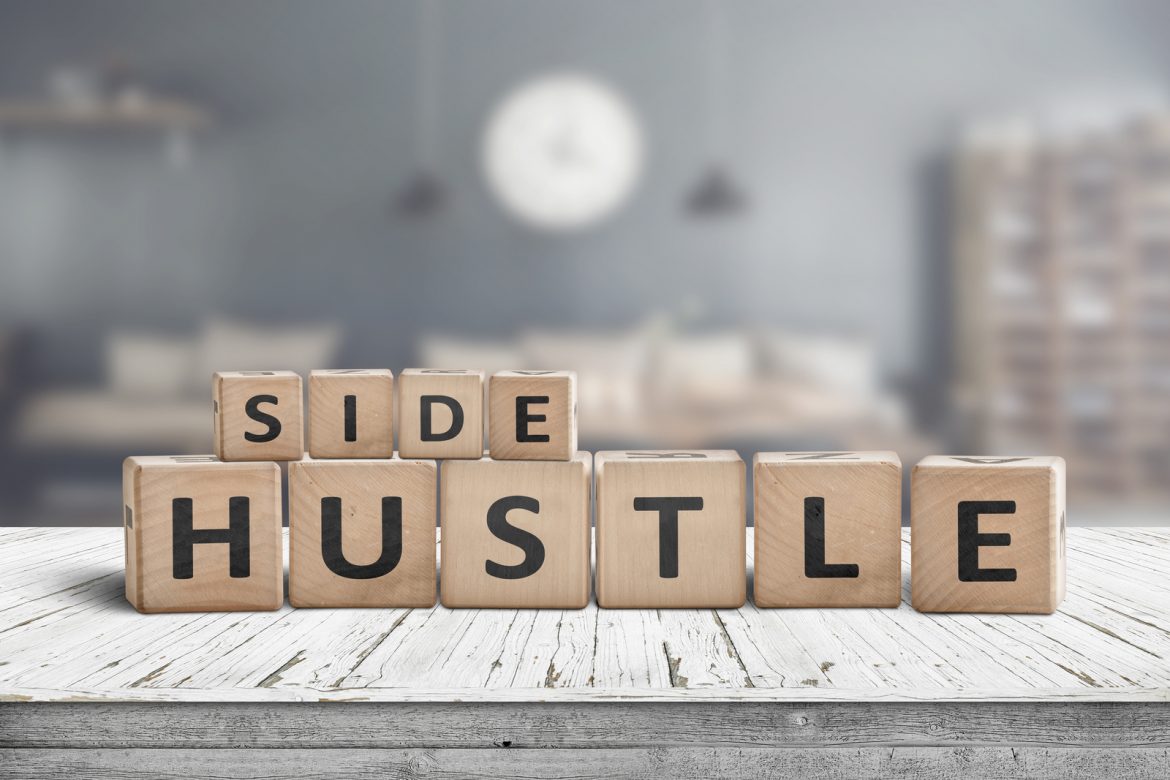 29057484_side-hustle-sign-on-a-plank-table Side hustle sign