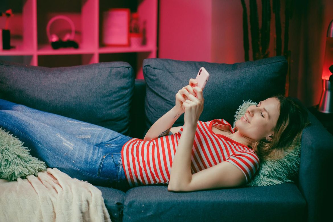 Relaxed girl holding her phone