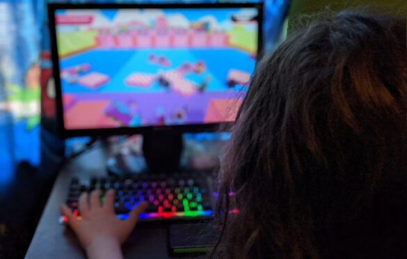 A Gamer Boy Play a Video Game