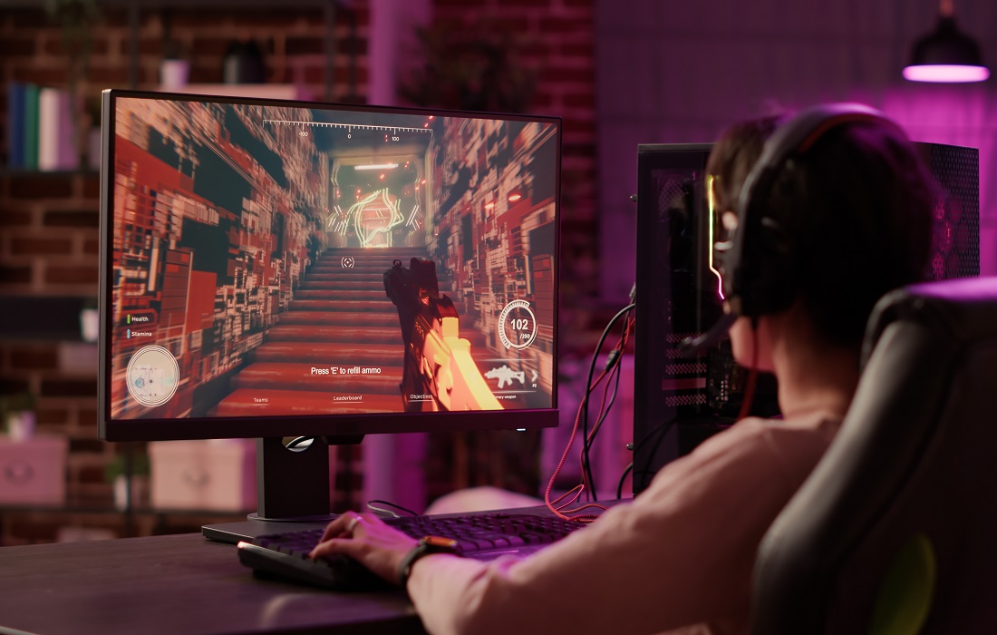 Gamer-girl-using-pc-gaming-setup-relaxing-playing-multiplayer-online-action-video-game
