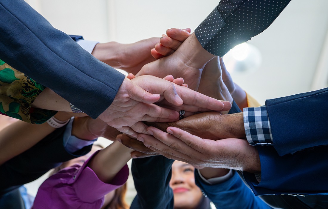 Team-putting-hands-together-group-of-diverse